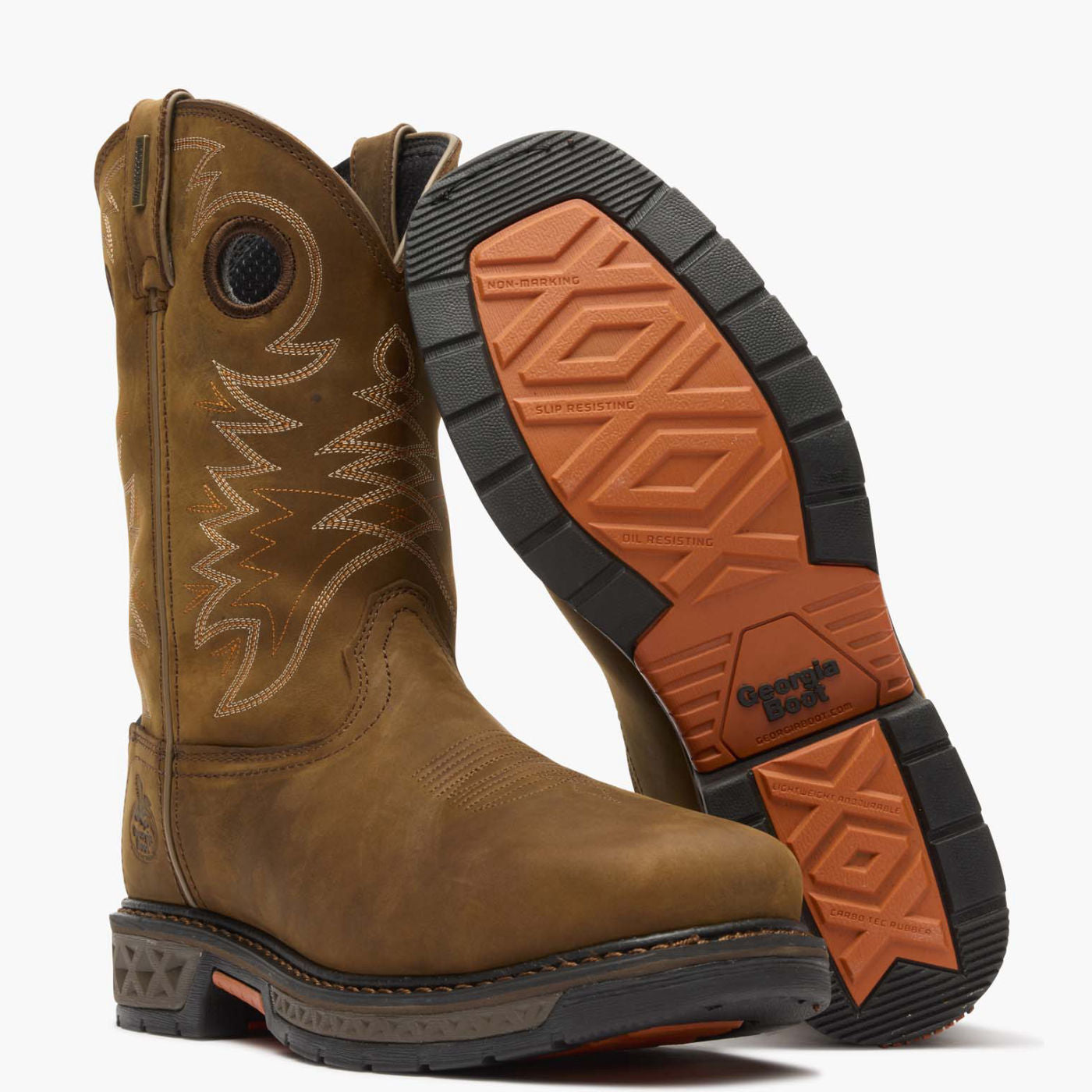 Brown work boot with orange and black sole on a white background