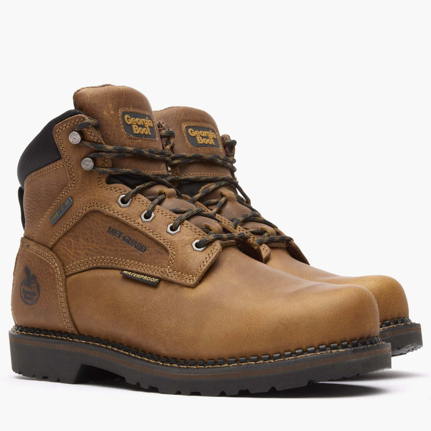 Pair of brown work boots with visible brand logo on a white background