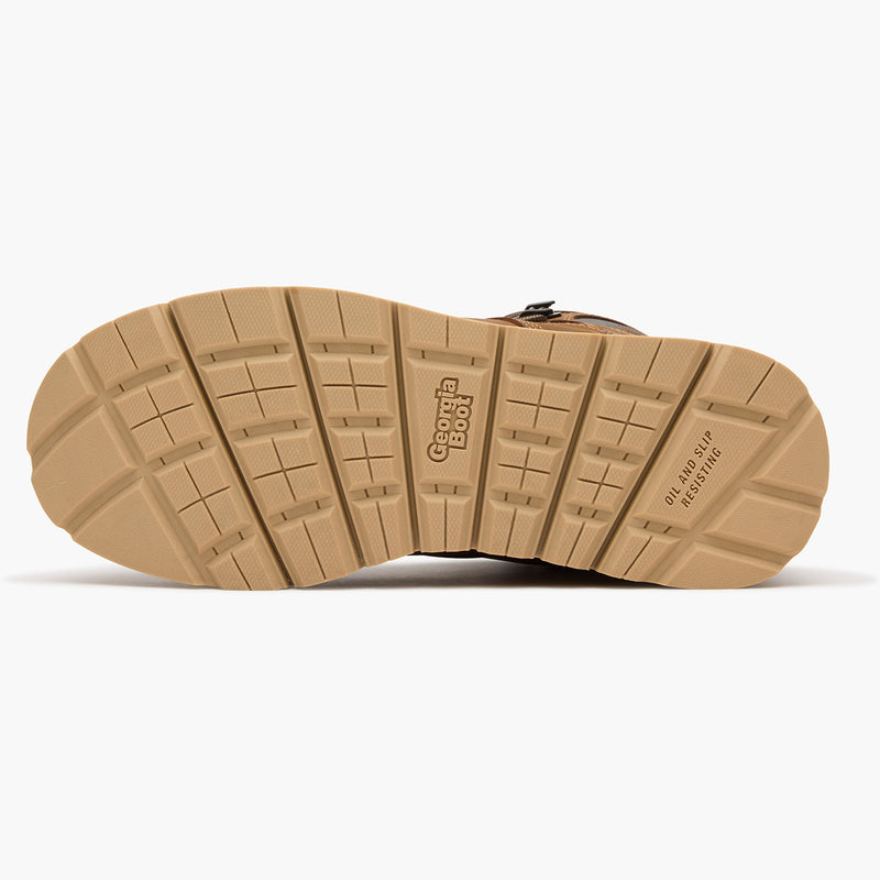 Close-up of a brown boot sole with tread pattern on a white background