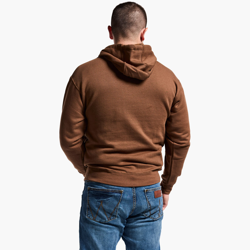 Man wearing a brown hoodie and blue jeans on a white background