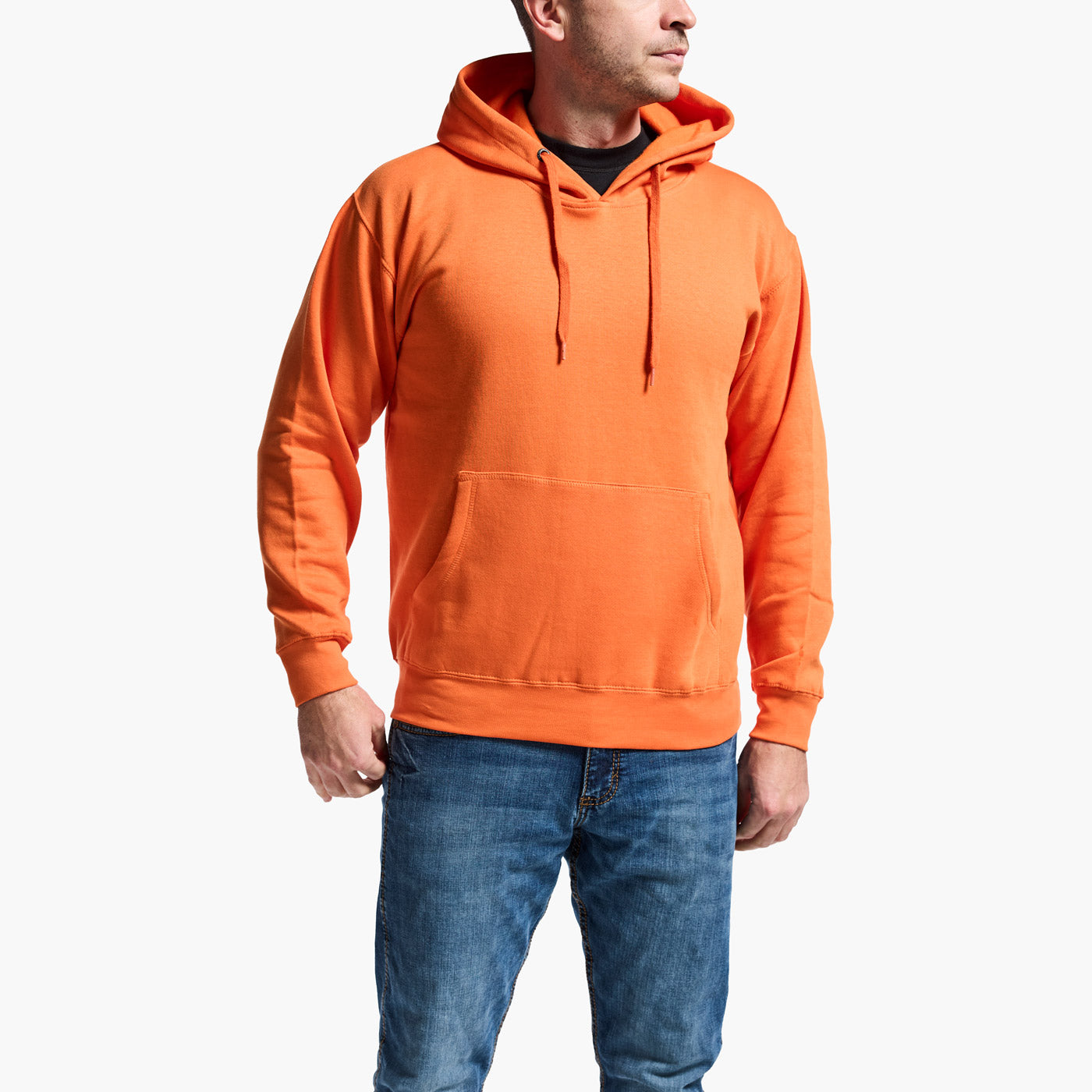 Person wearing an orange hoodie and blue jeans on a white background