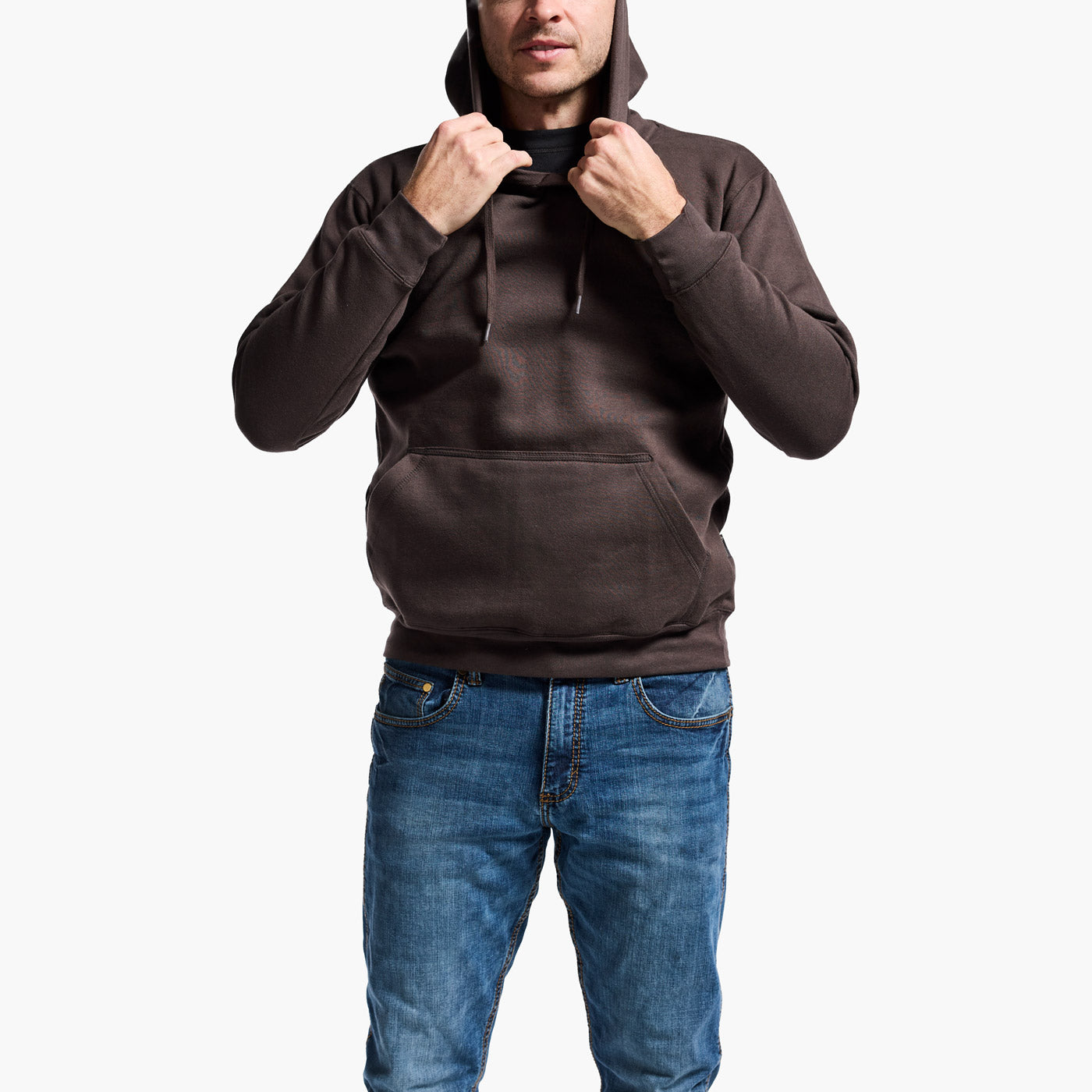 Person wearing a brown hoodie and blue jeans on a white background