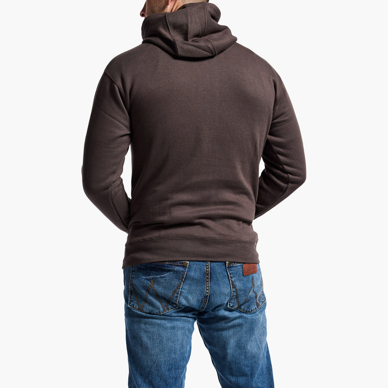 Person wearing a brown hoodie and blue jeans on a white background
