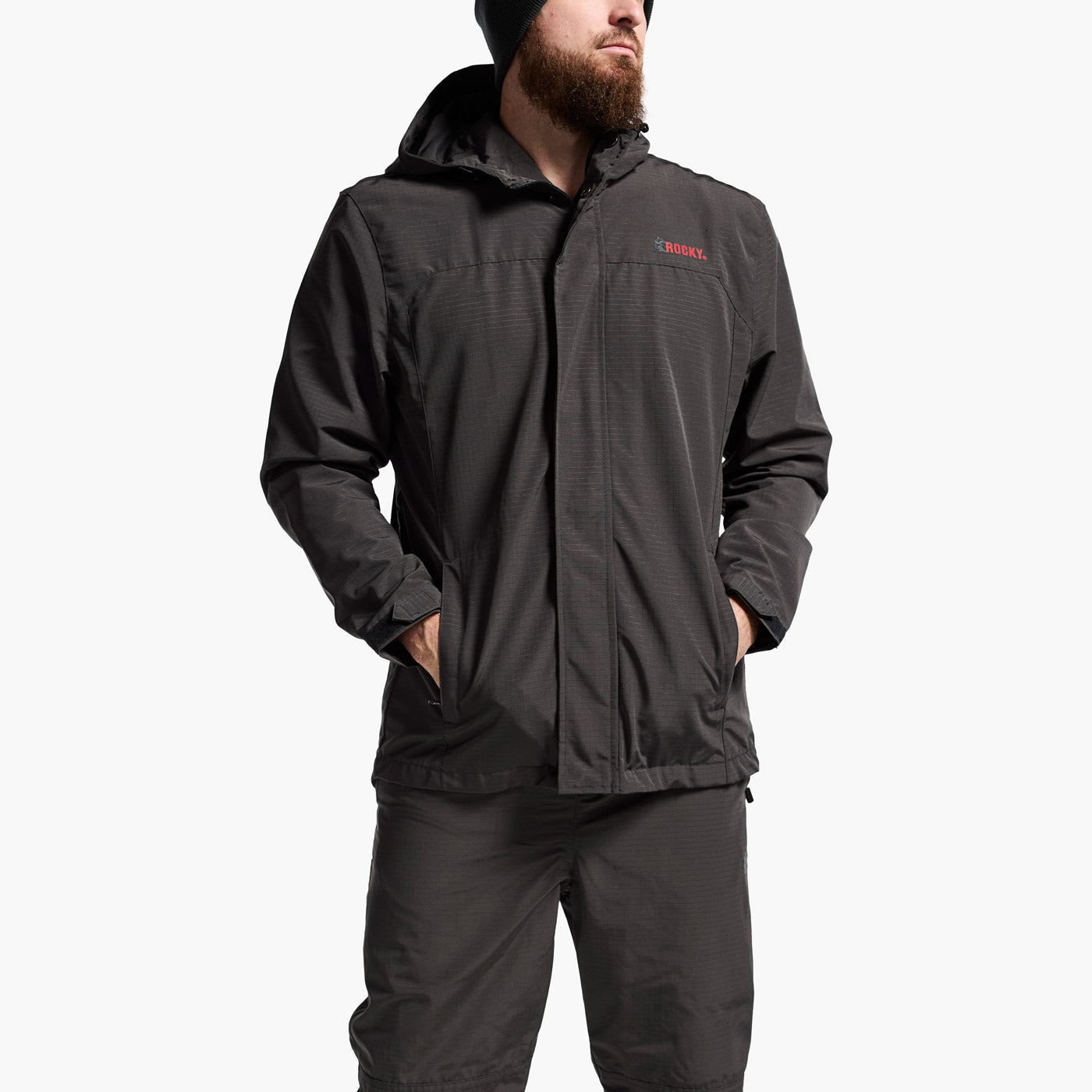 Person wearing a black jacket with a brand logo on a white background