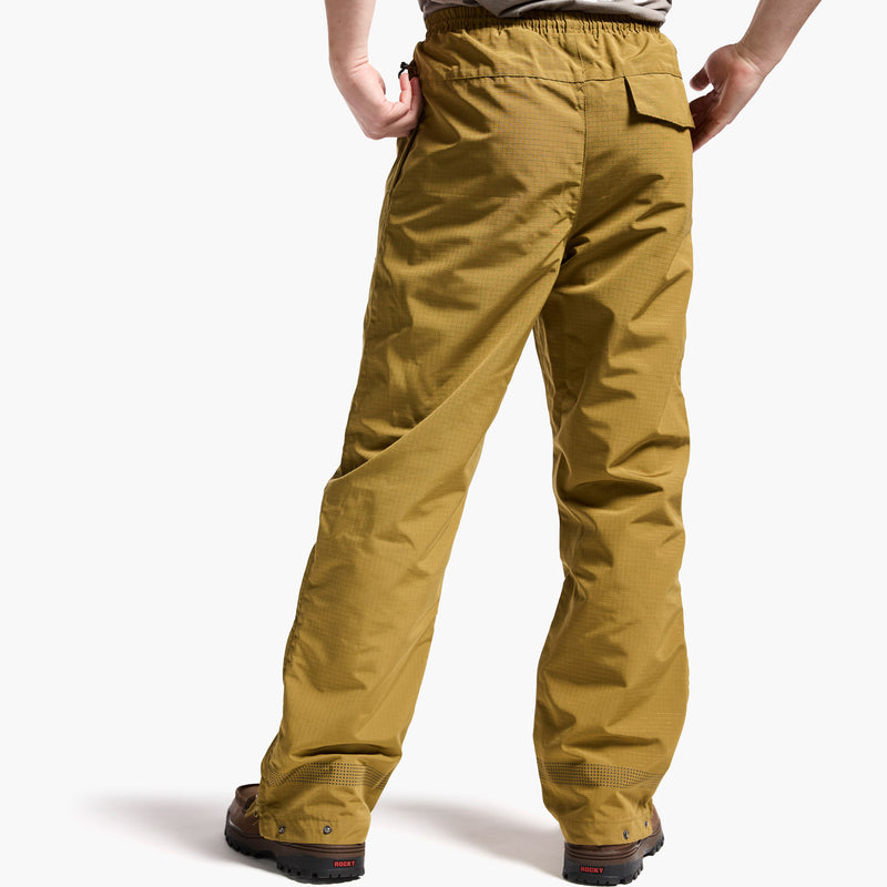 Yellow pants worn by a person on a white background